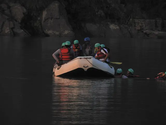 Rafters paddling through Ganga rapids in Rishikesh